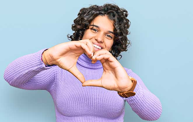 Beautiful woman's elated expression after dental restoration at Glenn Smile Center.