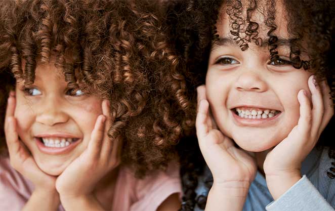 Children radiate joy during their lively pediatric dental appointment at Glenn Smile Center.