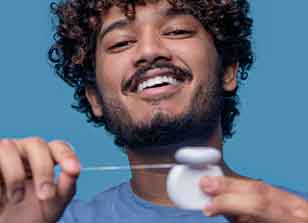 A man display joy after satisfying oral hygiene checks at Glenn Smile Center.