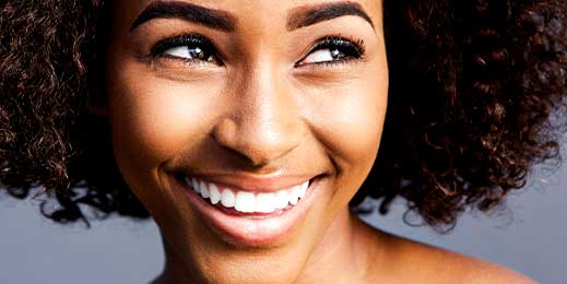 Woman's bright smile celebrates high-quality tooth whitening at Glenn Smile Center.