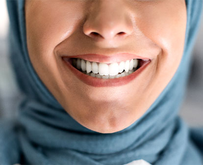 Beautiful woman's smile shines brighter following teeth whitening.