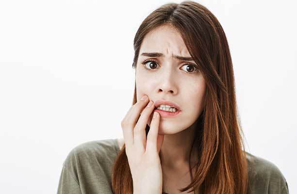 Teenagers grin widely, showcasing healthy teeth following gum disease treatment.